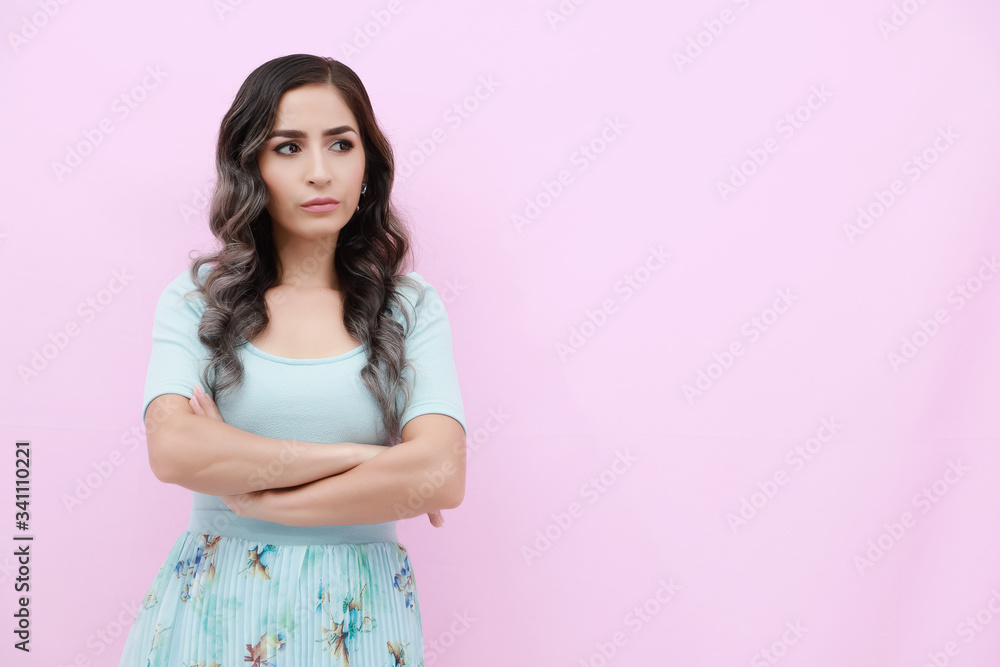 Young woman over isolated pink background doing angry gesture Young woman over isolated pink background doing angry gesture