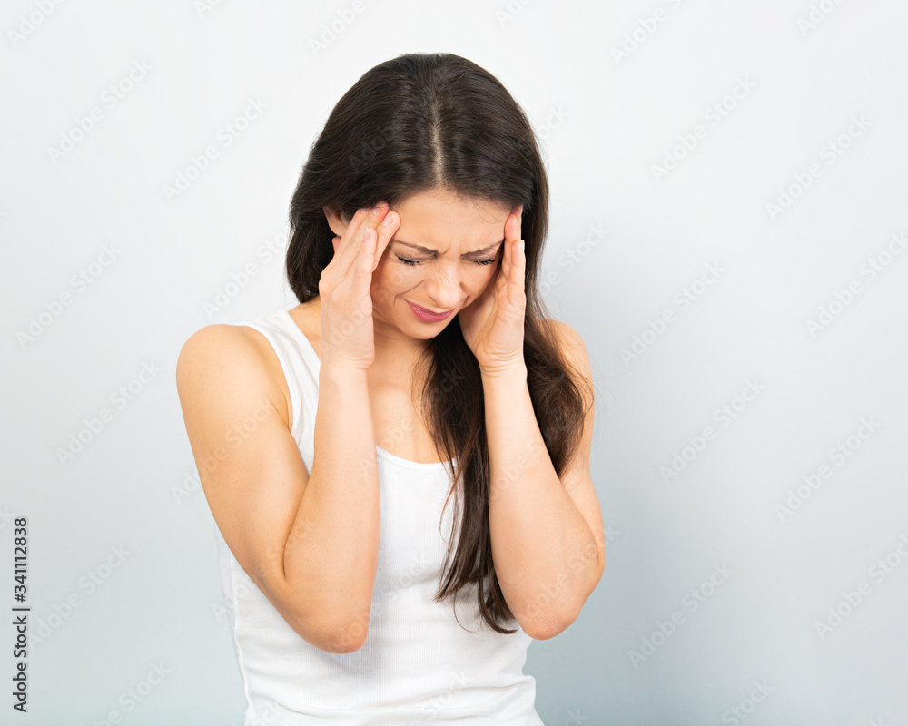 Concentrated sick woman in casual clothing holding the hands the head and find the solution on problem situation. Corona virus. Working at home. Concentrated sick woman in casual clothing holding the hands the head and find the solution on problem situation. Corona virus. Working at home.
