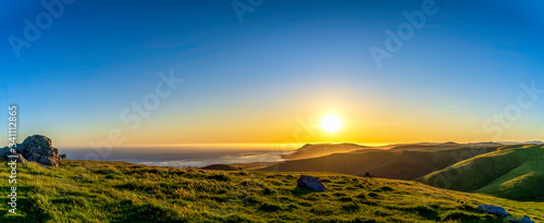 Panorama of Sunset over Mountains, Ocean, Hills