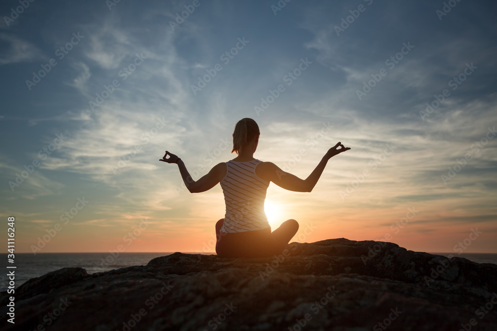 Silhouette meditation girl on the background of the sea and sunset. Yoga and healthy lifestyle. Silhouette meditation girl on the background of the sea and sunset. Yoga and healthy lifestyle.