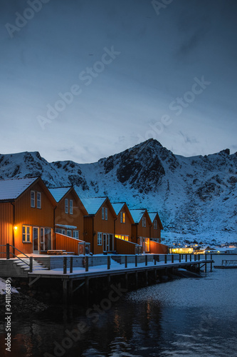 Orange cabins by the lake in Ballstad village, Norway photo