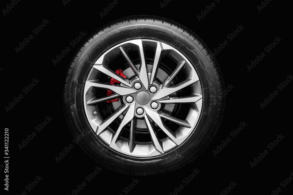 Obraz premium car wheel on a black background
