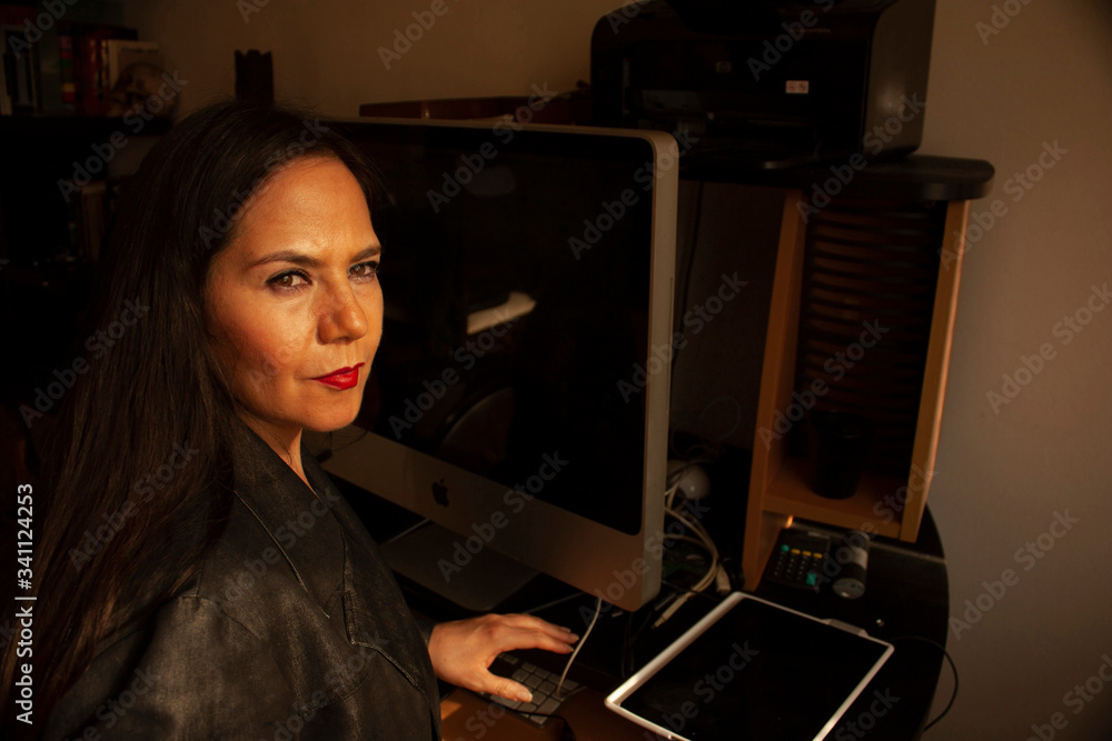 Home Office businesswoman dressed formally with a gray jacket Home Office businesswoman dressed formally with a gray jacket