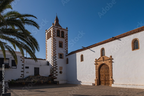 Central square with church tower in Betancuria village on Fuerteventura island in Spain. October 2019