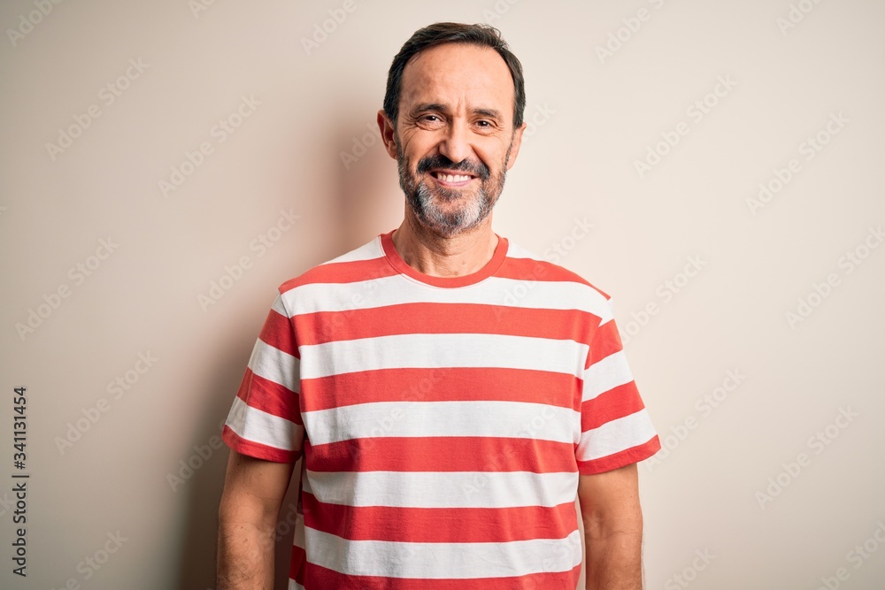 Middle age hoary man wearing casual striped t-shirt standing over isolated white background with a happy and cool smile on face. Lucky person. Middle age hoary man wearing casual striped t-shirt standing over isolated white background with a happy and cool smile on face. Lucky person.
