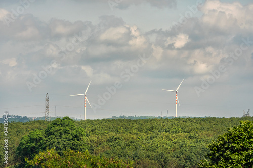 Landscape with Turbine Green Energy Electricity, Windmill for electric power production, Wind turbines generating electricity on rice field at Ea H'leo, Dak Lak, Vietnam. Clean energy concept.