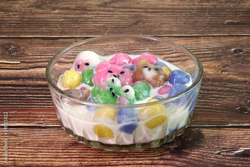 Fancy glutinous rice balls in cute animals shaped, cooked in fresh milk, popular fusion food in Asia. Selective focus photo