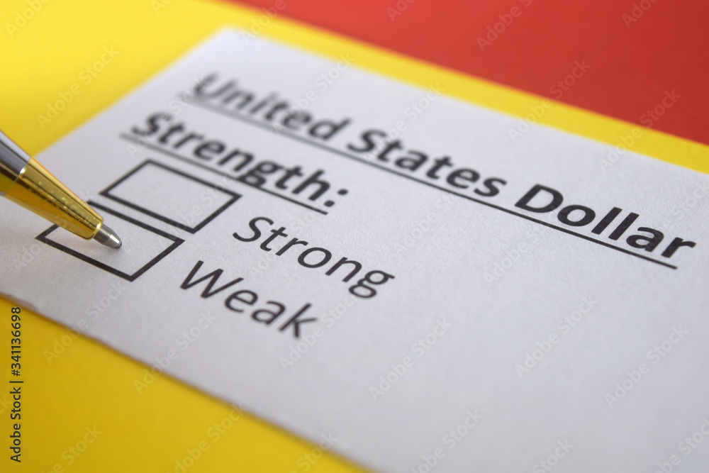 One person is answering question about strength of united states dollar. One person is answering question about strength of united states dollar.