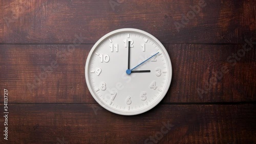 Wallpaper Mural The Time On The Clock Three. White Clock With The Blue Arrow With The Arabic Numerals On An Brown Wooden Background. Torontodigital.ca