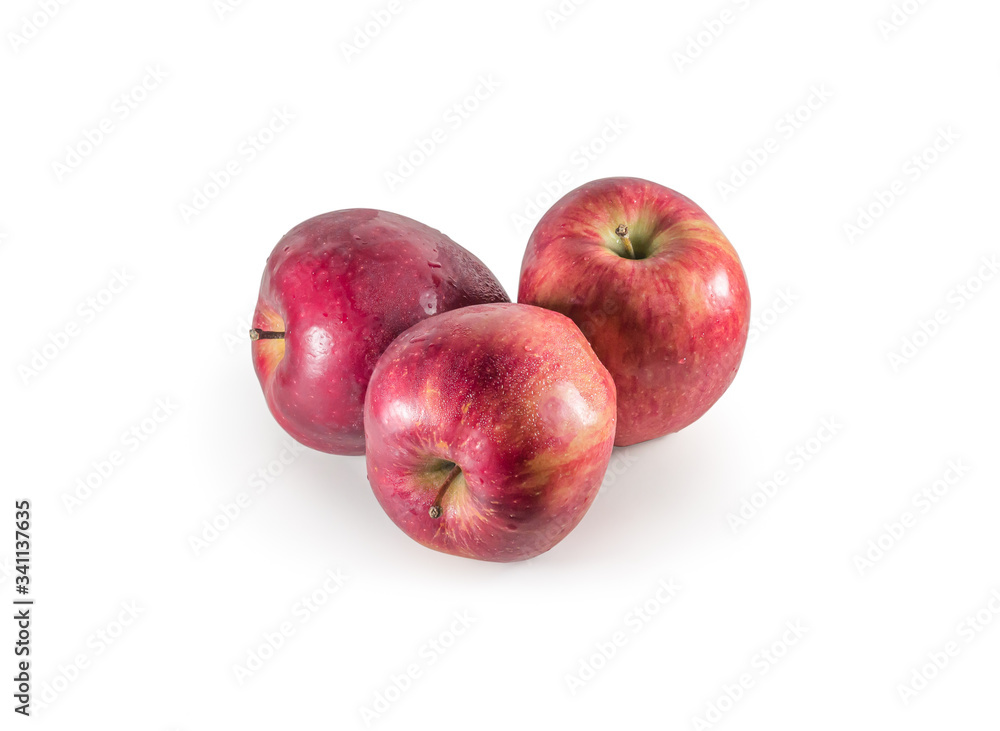 A set of three fresh red apples with drops isolated on white background A set of three fresh red apples with drops isolated on white background