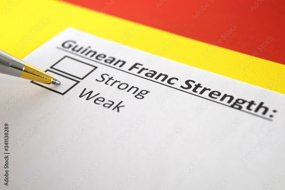 One person is answering question about strength of Guinean Franc Currency. One person is answering question about strength of Guinean Franc Currency.