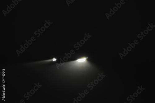 Fotografie Headlights through the dark