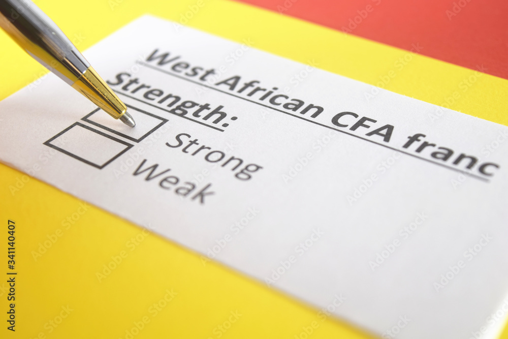 One person is answering question about strength of West African CFA Franc. One person is answering question about strength of West African CFA Franc.