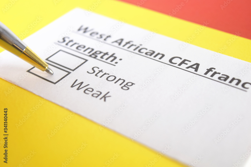 One person is answering question about strength of West African CFA Franc. One person is answering question about strength of West African CFA Franc.