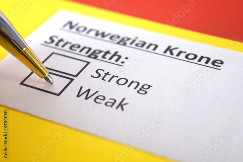 One person is answering question about strength of Norwegian Krone.