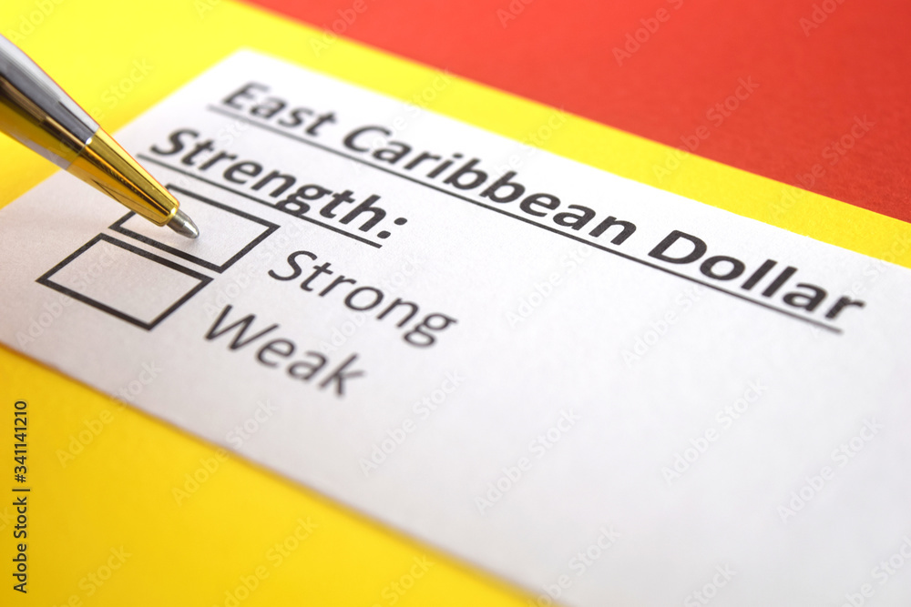 One person is answering question about strength of East Caribbean Dollar. One person is answering question about strength of East Caribbean Dollar.