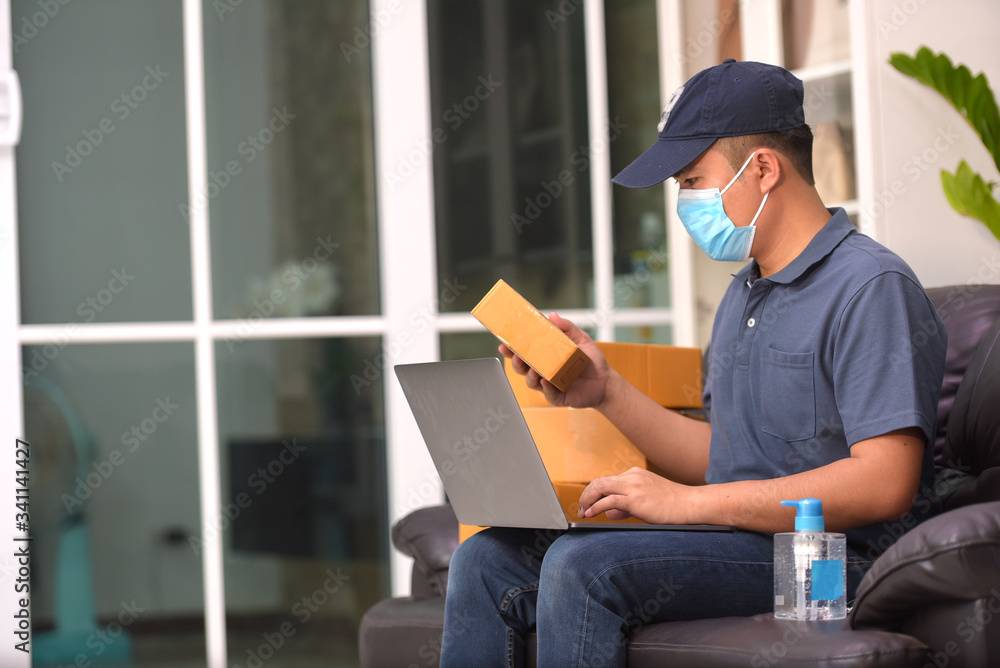 The delivery staff put on a protective mask of the Covid 19 virus.