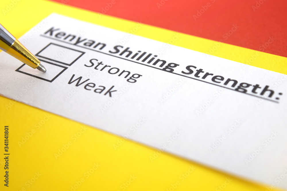 Obraz premium One person is answering question about strength of Kenyan Shilling.