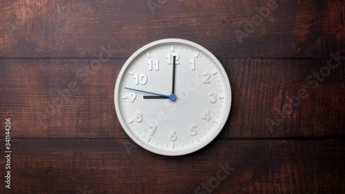 Wallpaper Mural The Time On The Clock Nine. White Clock With The Blue Arrow With The Arabic Numerals On An Brown Wooden Background. Torontodigital.ca