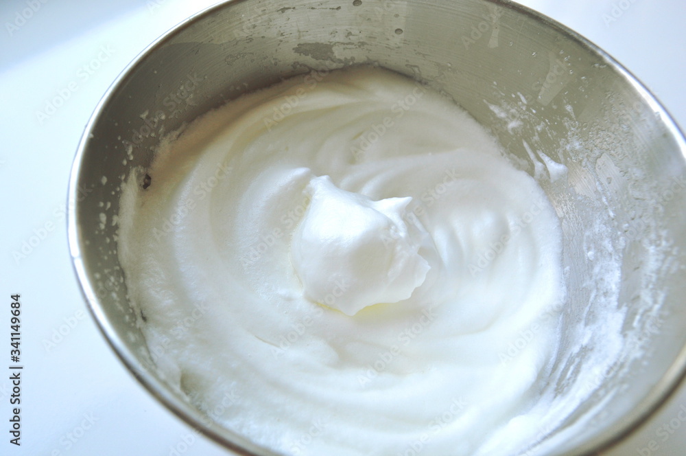 Recipe sequence - mini fruit sponge cakes - baking preparation. Mixing eggs, yolks, flour and fruit into a liquid batter Recipe sequence - mini fruit sponge cakes - baking preparation. Mixing eggs, yolks, flour and fruit into a liquid batter