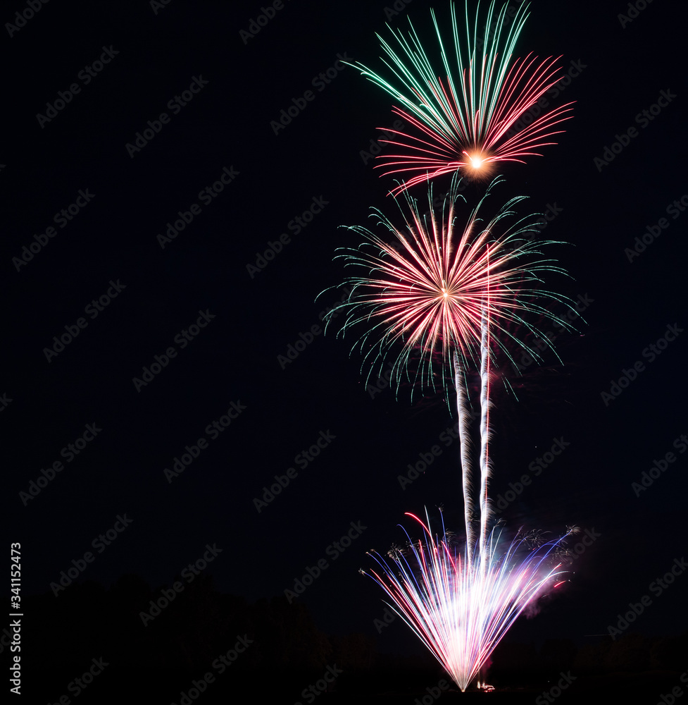 Beautiful fireworks bursting in the evening sky with copy space Beautiful fireworks bursting in the evening sky with copy space