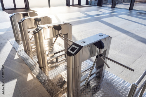 Electronic turnstile. Access system to the building. Pass through the passes. Security systems for rooms. Several turnstiles are installed nearby. Check Point. Automatic checkpoint. Building security.