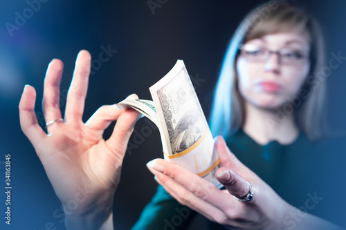 Girl's hands with a stack o...
