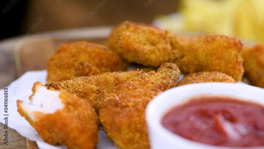 Crispy Chicken Nuggets on a rotating plate (seamless loopable)