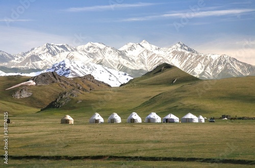 The ger camp in a large meadow at Song kul lake ,  Naryn of Kyrgyzstan photo