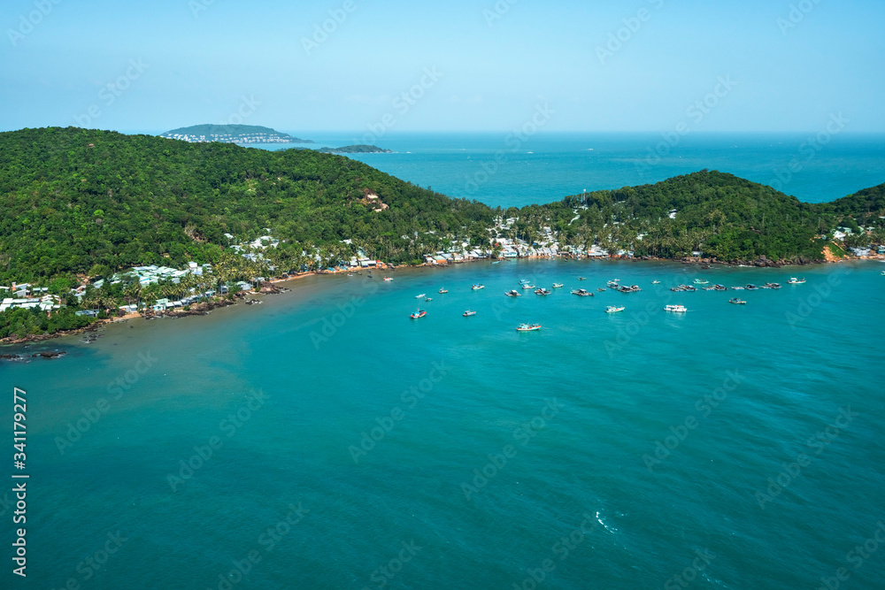 Aerial view of white sand beach and boat on the blue lagoon aqua sea. Royalty high quality free stock image of Gam Ghi island in Phu Quoc, Kien Giang, Vietnam
