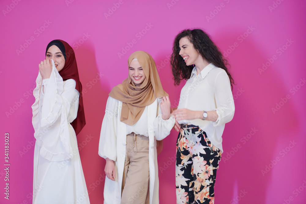 muslim women in fashionable dress isolated on pink muslim women in fashionable dress isolated on pink