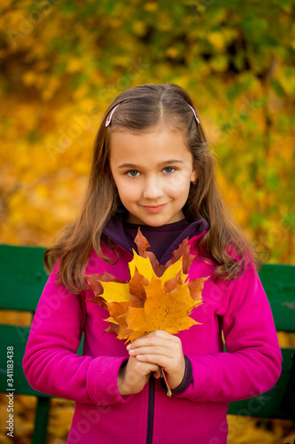 Little Child Outdoors In Autumn Park.
