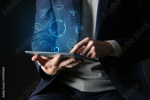 Man with tablet computer on...