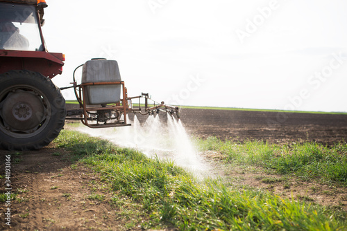 Agricultural sprayers, spray chemicals on field. spraying pesticides on field with sprayer