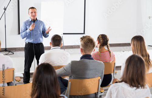 Male teacher lecturing to students