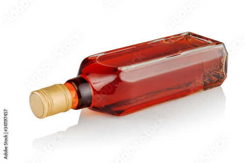 a bottle with an alcoholic drink on a white background