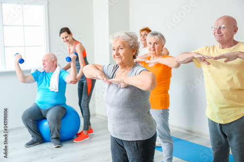 Elderly people exercising i...