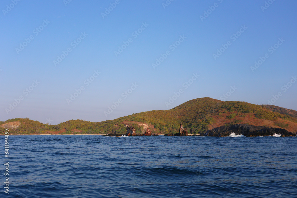 Island in the sea and bright sky. Island in the sea and bright sky.