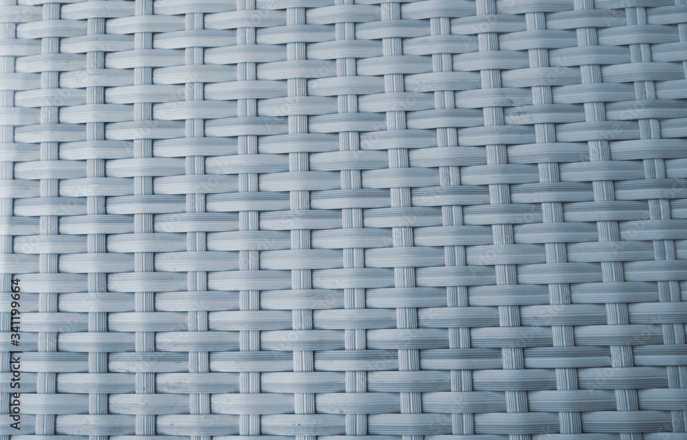 Abstract background of wicker stripes of matting. Texture and patterns handmade. Outdoor furniture close-up. Abstract background of wicker stripes of matting. Texture and patterns handmade. Outdoor furniture close-up.