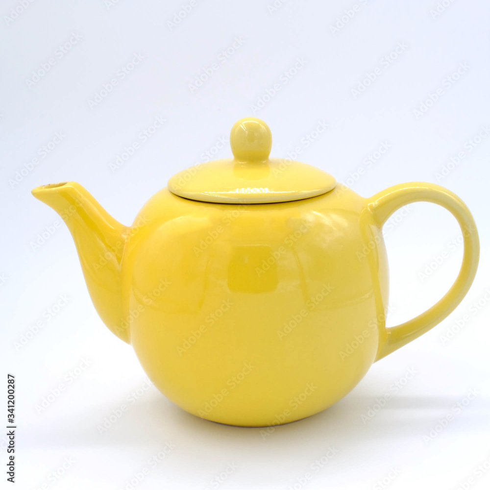 cup with tea and teapot on white background, over light
cup with tea and teapot on white background, over light
