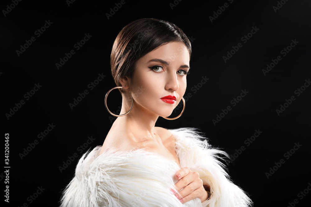 Young woman with beautiful makeup on dark background Young woman with beautiful makeup on dark background