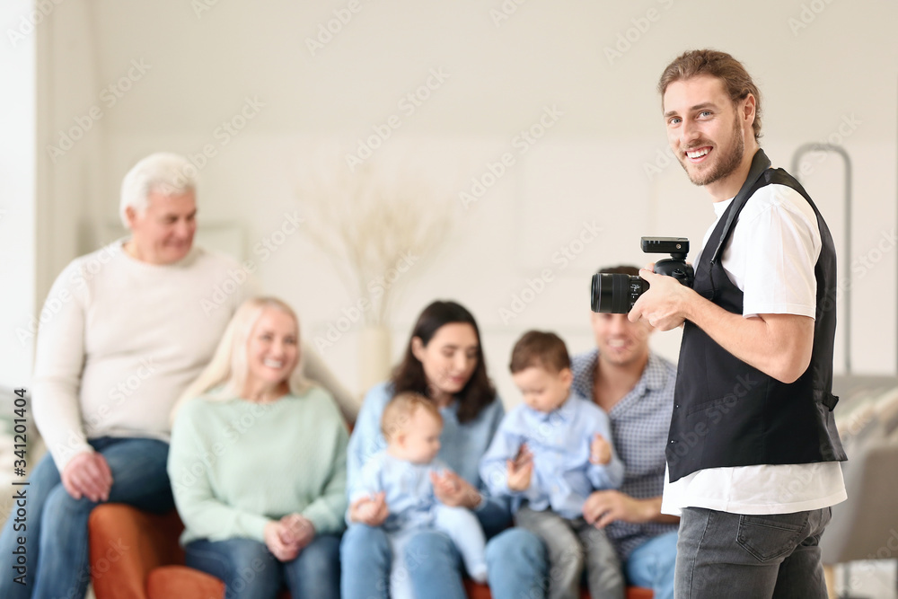 Portrait of photographer working with family in studio Portrait of photographer working with family in studio