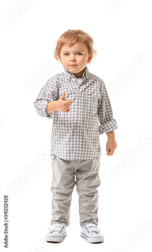 Cute little boy showing thu...