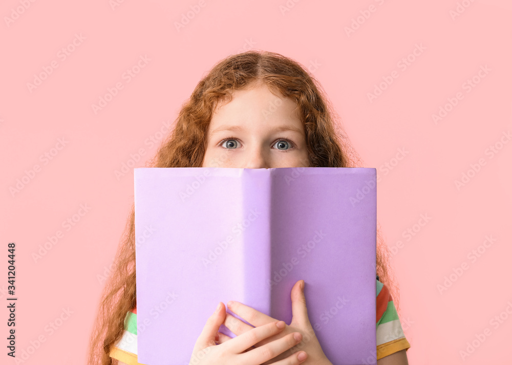 Cute little girl with book on color background Cute little girl with book on color background