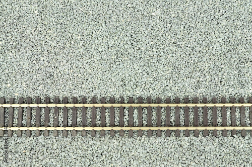 Fotografie Fine grey gravel background used as track ballast for model railways with sectio