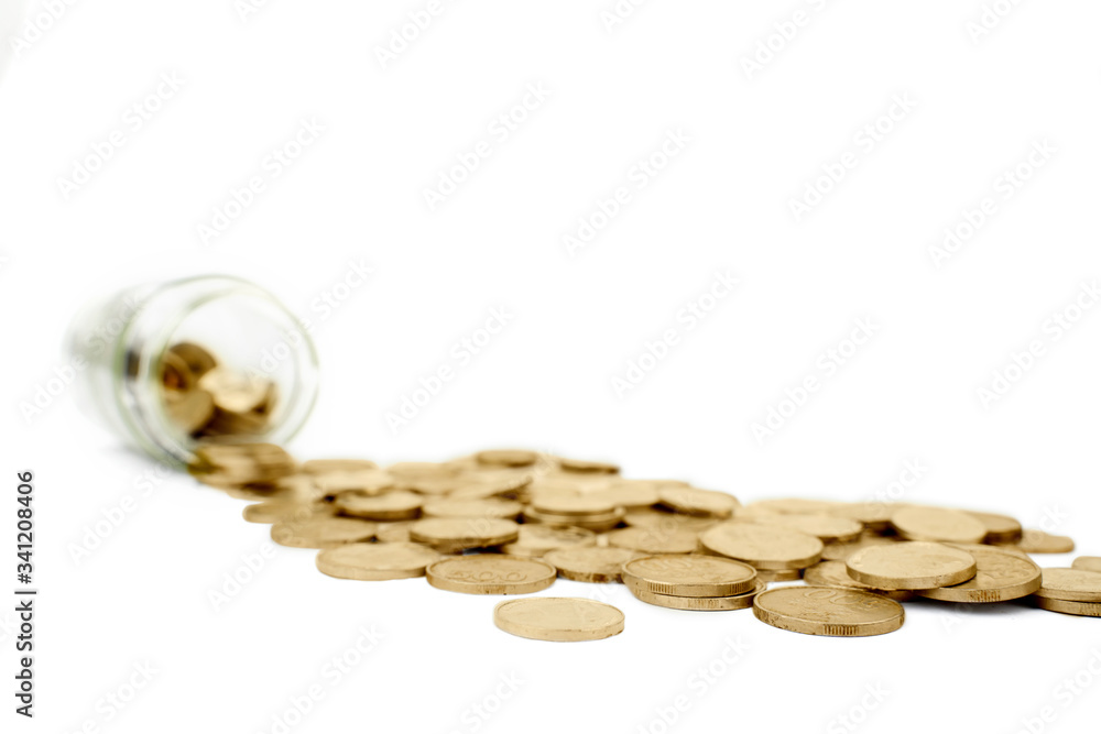 Golden coins and a glass jar in the studio Golden coins and a glass jar in the studio