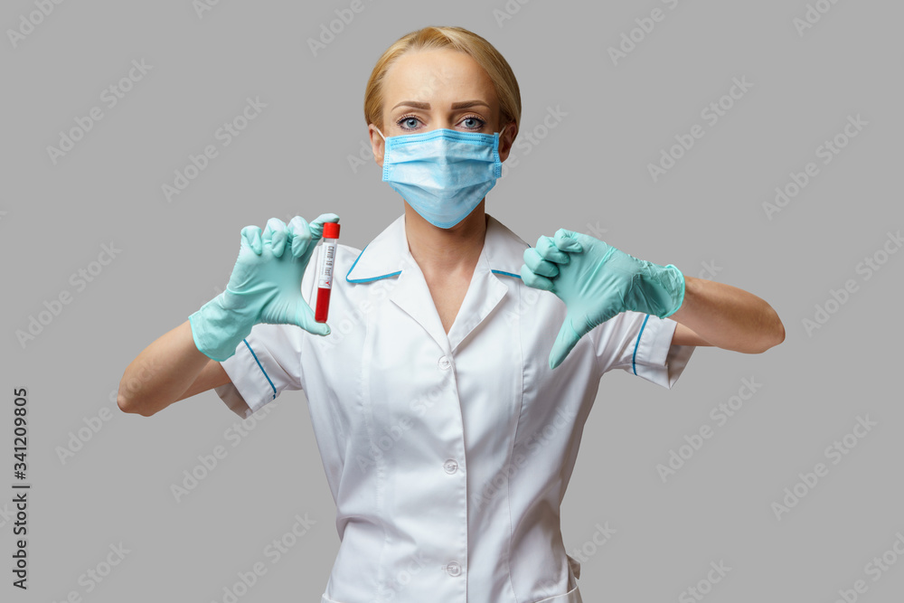 medical doctor nurse woman wearing protective mask and gloves - holding virus blood test medical doctor nurse woman wearing protective mask and gloves - holding virus blood test