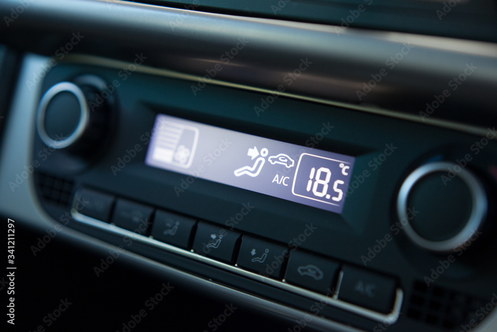 Close up shot of modern car digital climate control panel Close up shot of modern car digital climate control panel