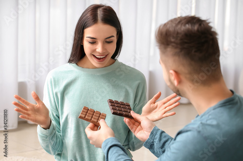 Young man offering to woman...