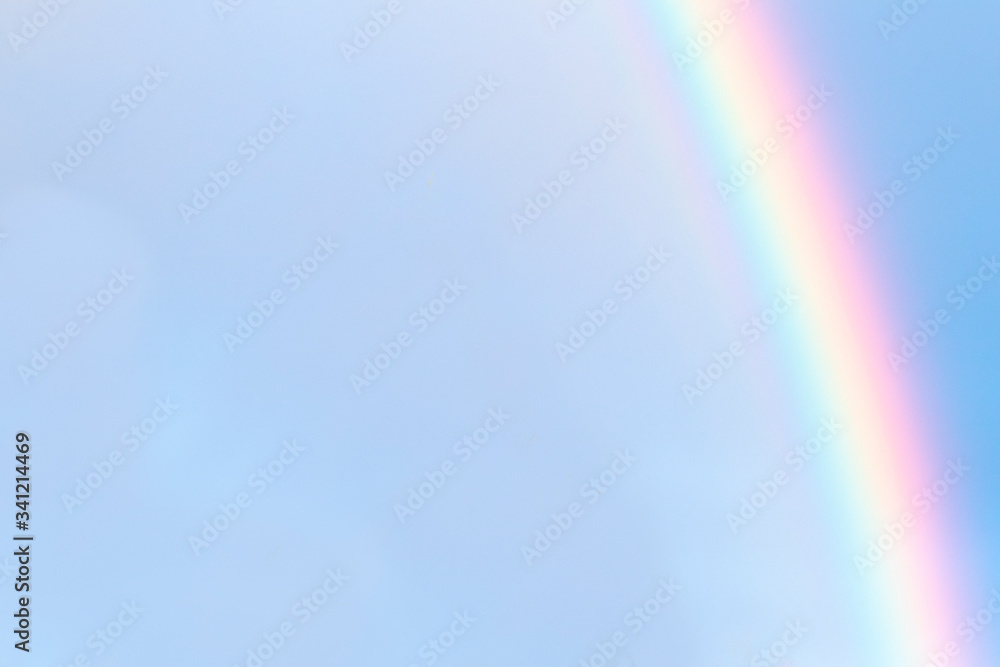 Rainbow against a clear blue sky. Copy space